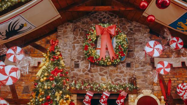 Red post box for letters to Lapland to Santa Claus. Christmas tr