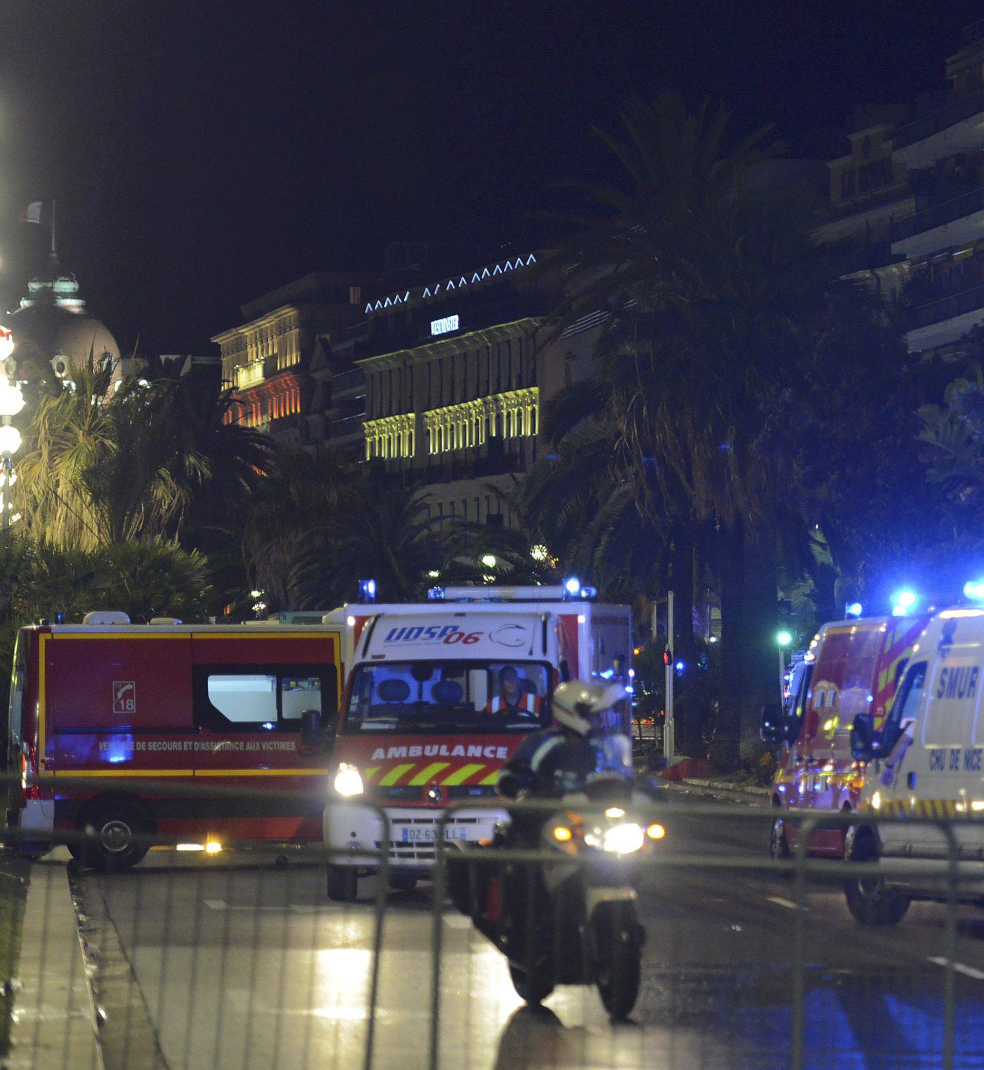French police and rescue forces vehicles are seen on the Promenade des Anglais after at least 60 people were killed in Nice when a truck ran into a crowd celebrating the Bastille Day national holiday