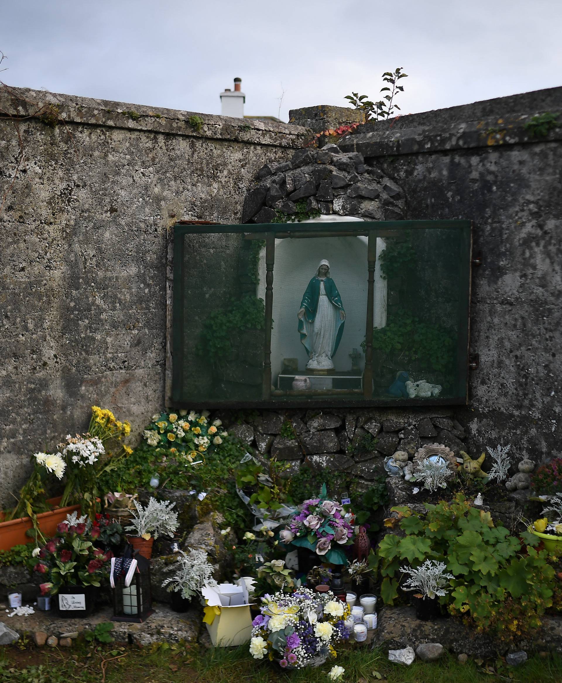 A man is seen at the site of the Tuam babies graveyard where the bodies of 796 babies were uncovered at a former Catholic home in Tuam