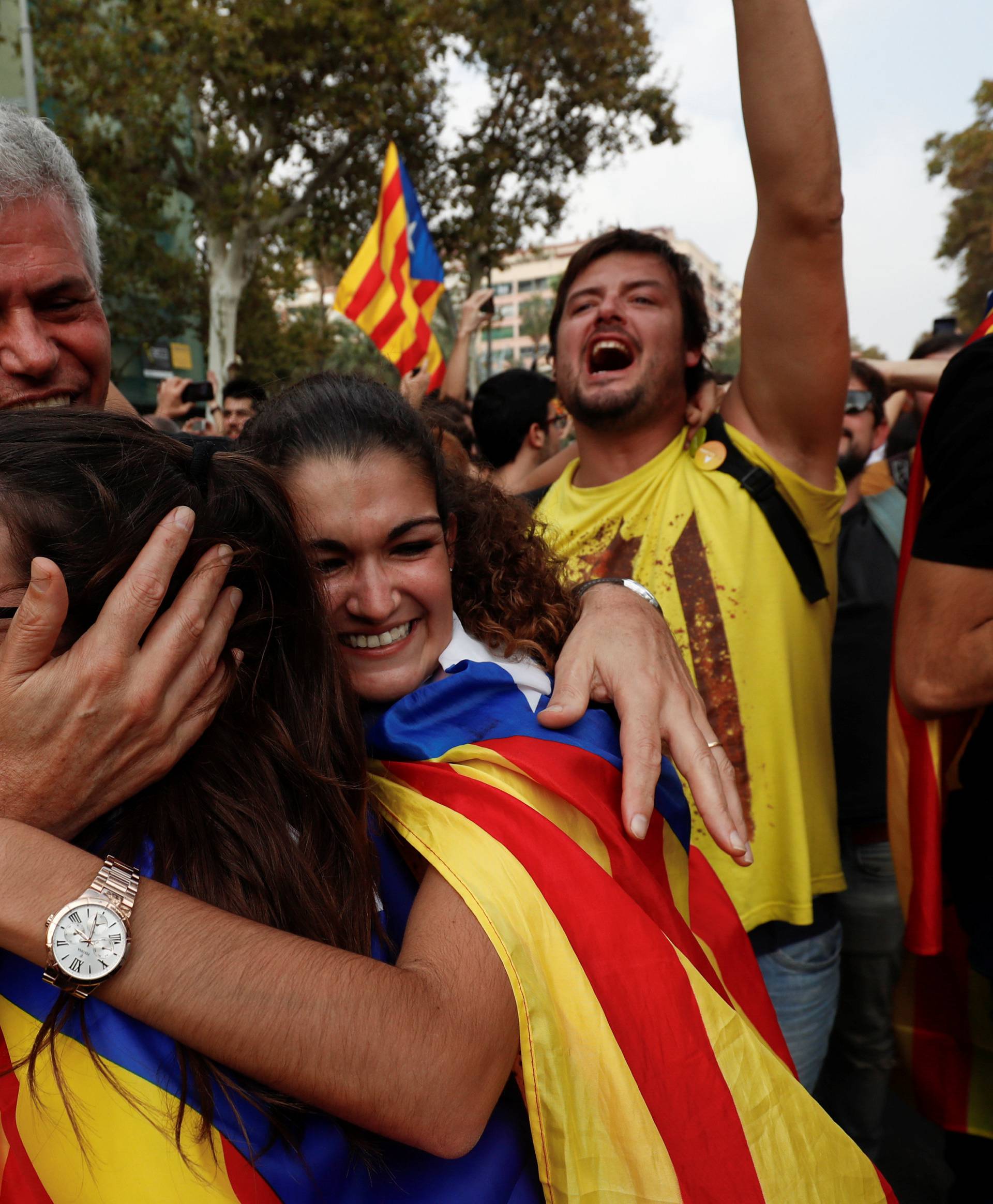 People celebrate after the Catalan regional parliament declares the independence from Spain in Barcelona