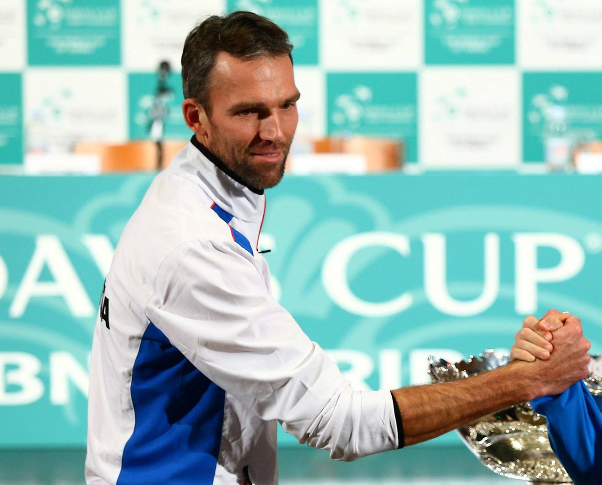 Croatia's tennis team player Ivo Karlovic and Argentina's tennis team player Federico Delbonis pose for a picture after the official draw for their Davis Cup finals in Zagreb