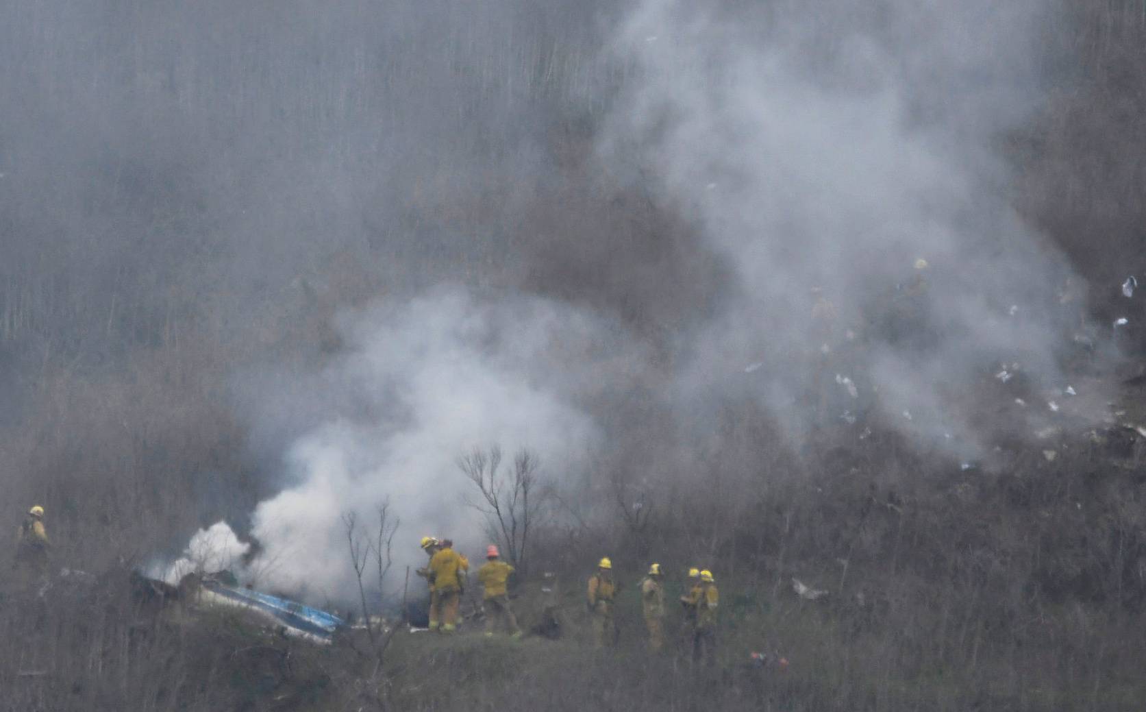 LA county firefighters on the scene of a helicopter crash that reportedly killed Kobe Bryant in Calabasas