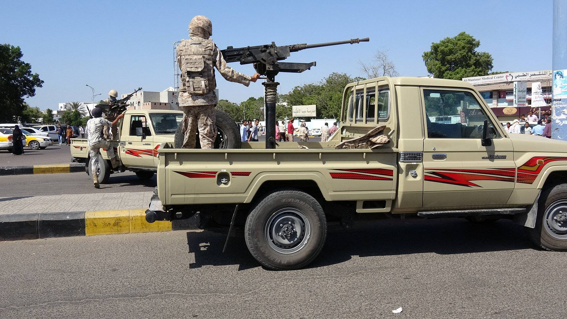 Army patrols are seen on a street near the site of a suicide bombing in the southern port city of Aden, Yemen