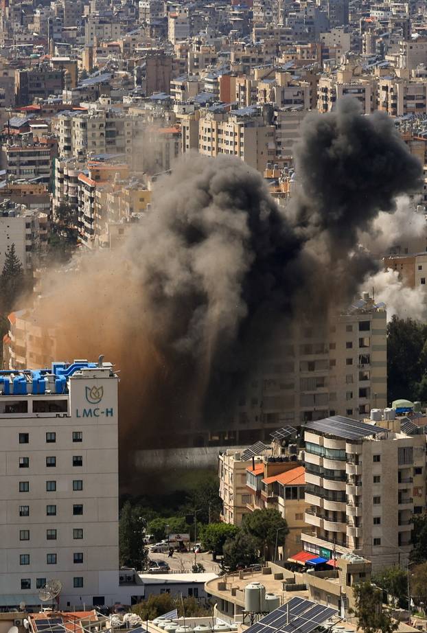 Smoke rises following an Israeli strike on the southern suburbs of Beirut