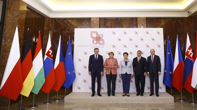 Slovakia's PM Fico, German Chancellor Merkel, Poland's PM Szydlo, Hungary's PM Orban and Czech Republic's PM Sobotka pose for media in Warsaw