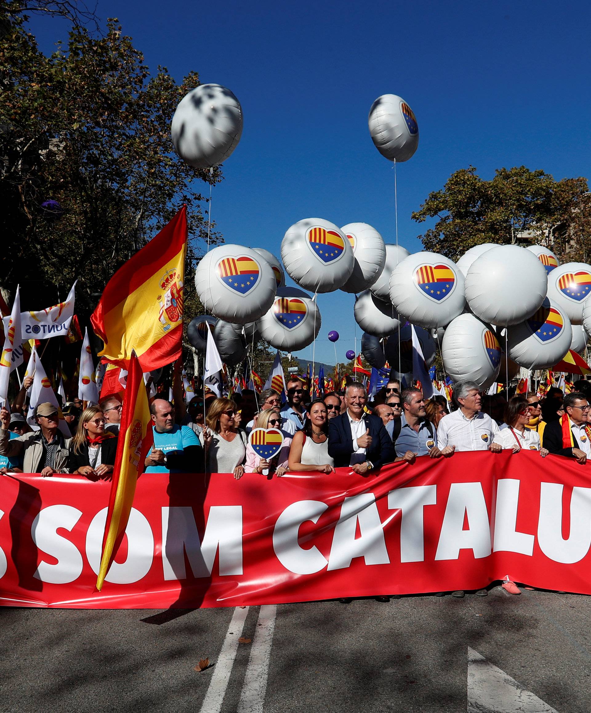 Pro-unity supporters take part in a demonstration in central Barcelona