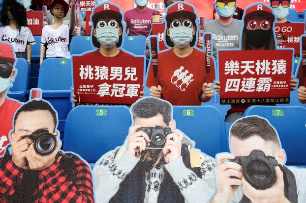 Dummies replaced audience due to the outbreak of the coronavirus disease (COVID-19) at the first professional baseball league game of the season at Taoyuan International baseball stadium in Taoyuan city