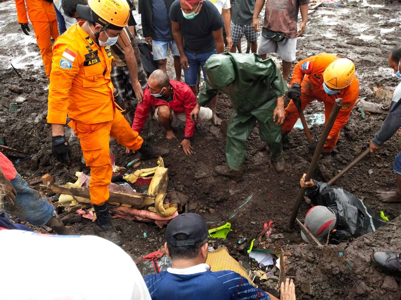 Indonesia rescue agency search for a body at an area affected by flash floods after heavy rains