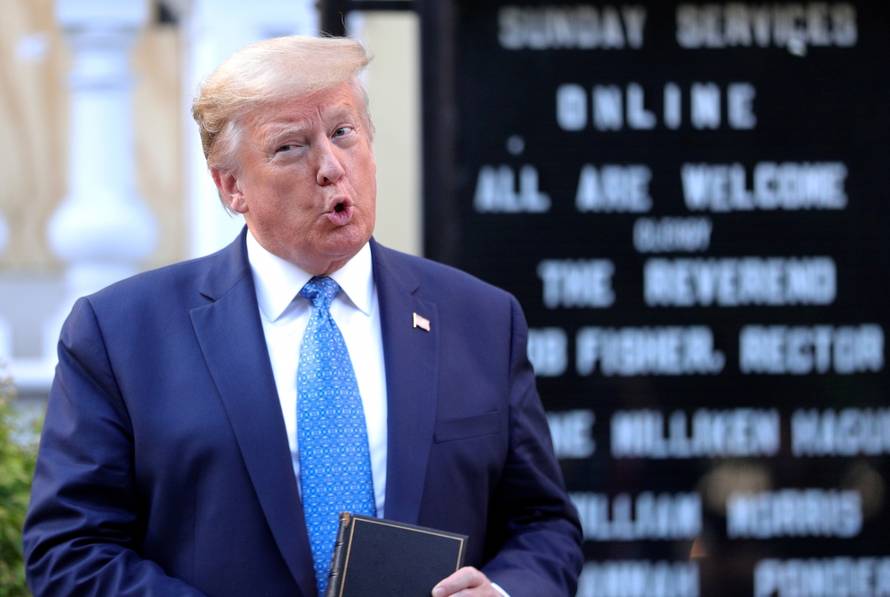 U.S. President Trump holds a Bible during photo opp in front of St John's Church in Washington