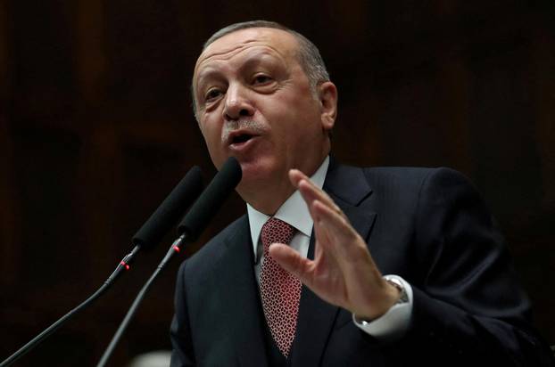 FILE PHOTO: Turkish President Tayyip Erdogan addresses members of parliament from his ruling AK Party during a meeting at the Turkish parliament in Ankara