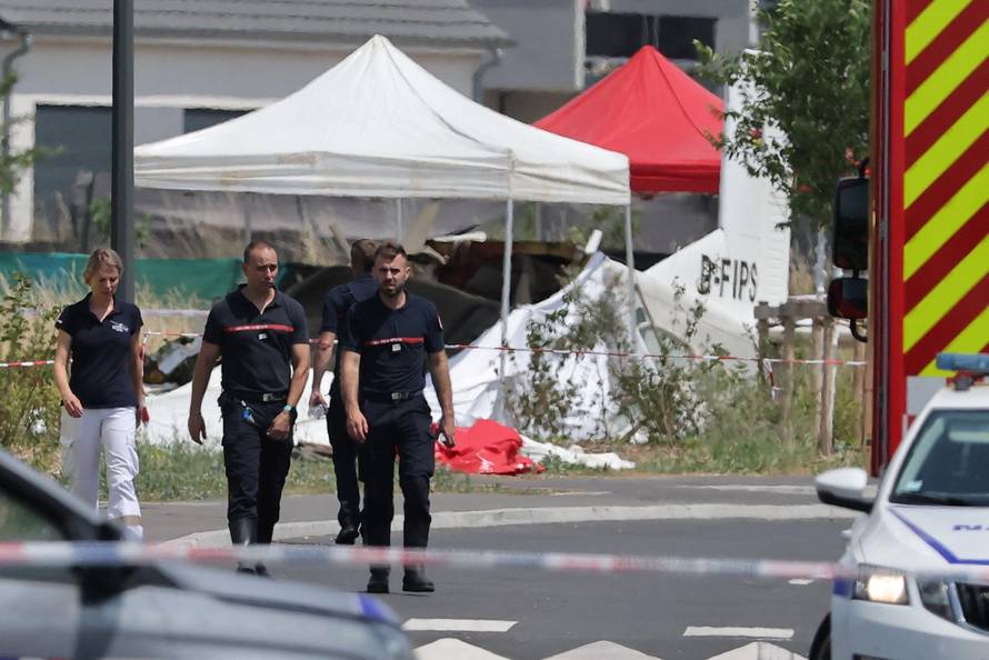French rescuers work at the site of a plane crash, in Tomblaine