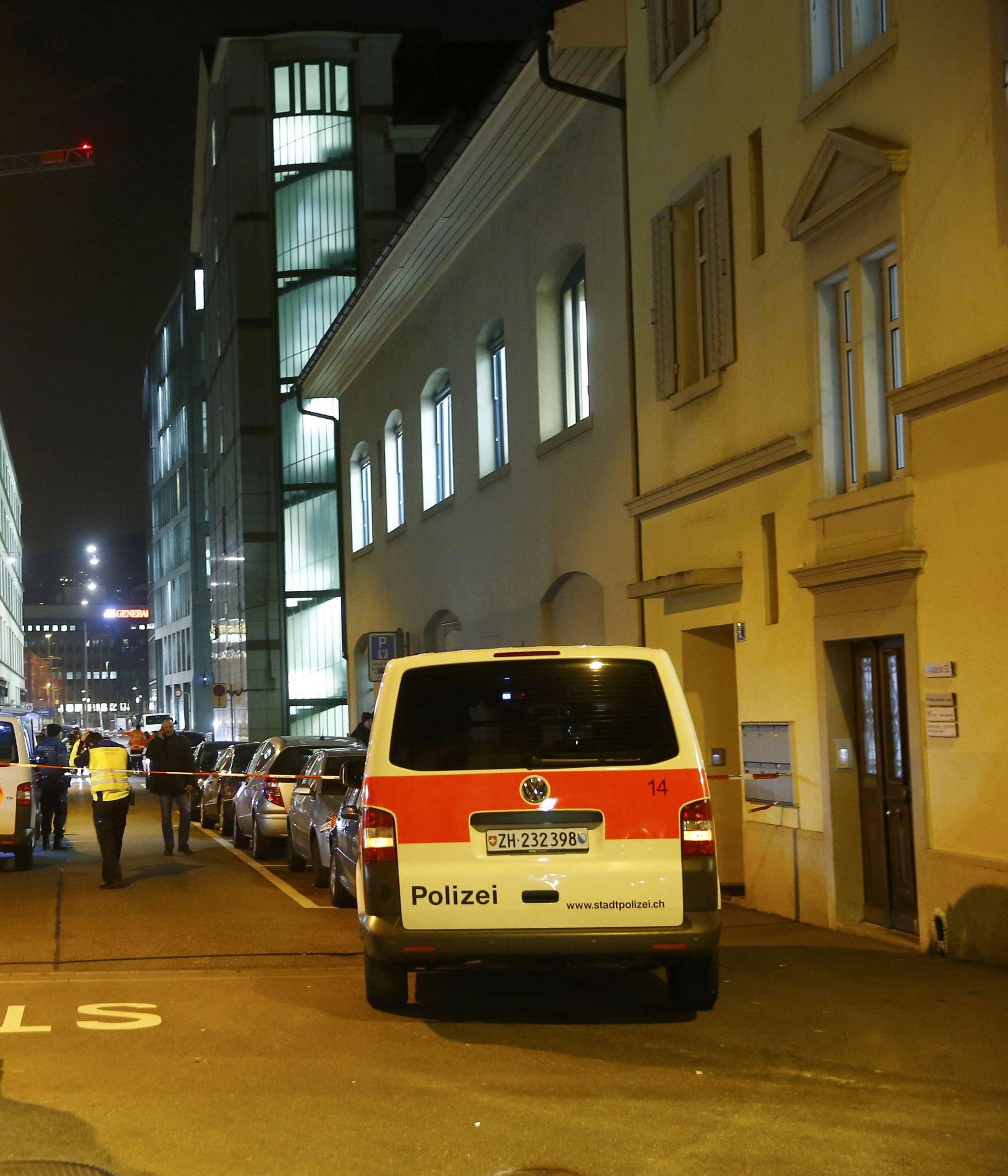 Police stand outside an Islamic center in central Zurich