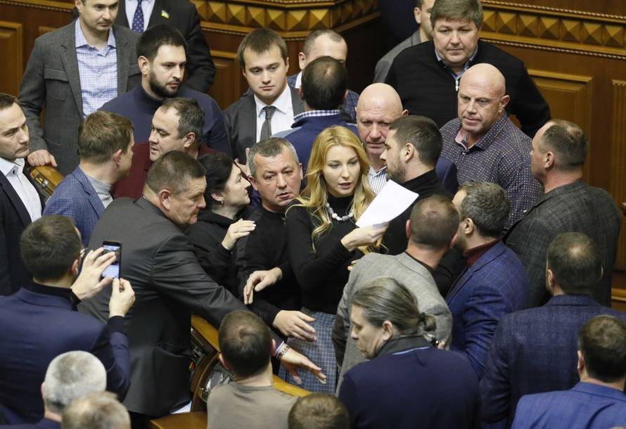Lawmakers argue between each other during a parliament session in Kiev