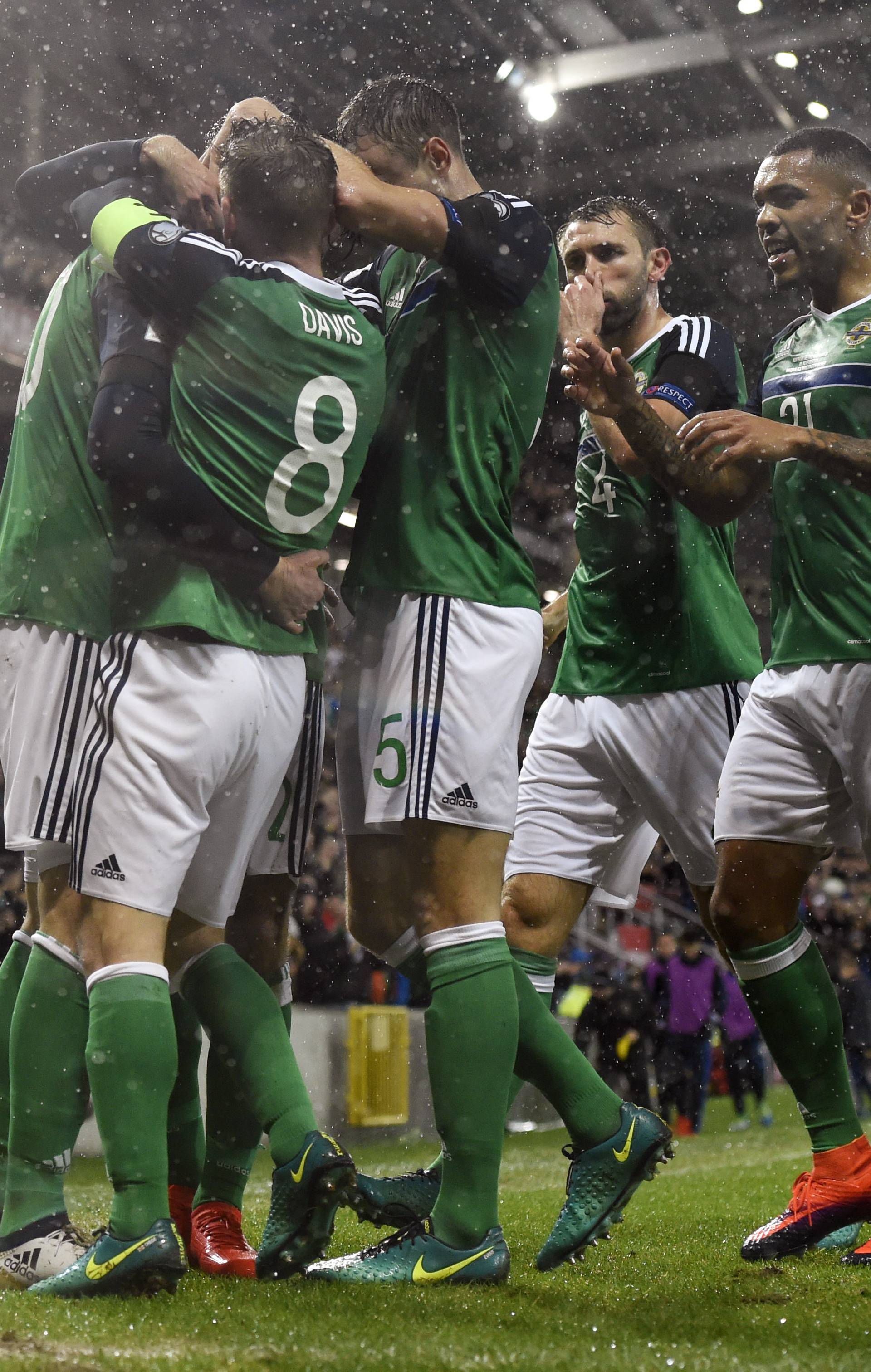 Northern Ireland's Kyle Lafferty celebrates scoring their first goal with team mates