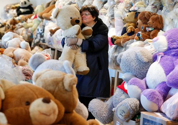 Valeria Schmidt, nicknamed as "Teddy Bear Mama", hugs a teddy bear in Harsany