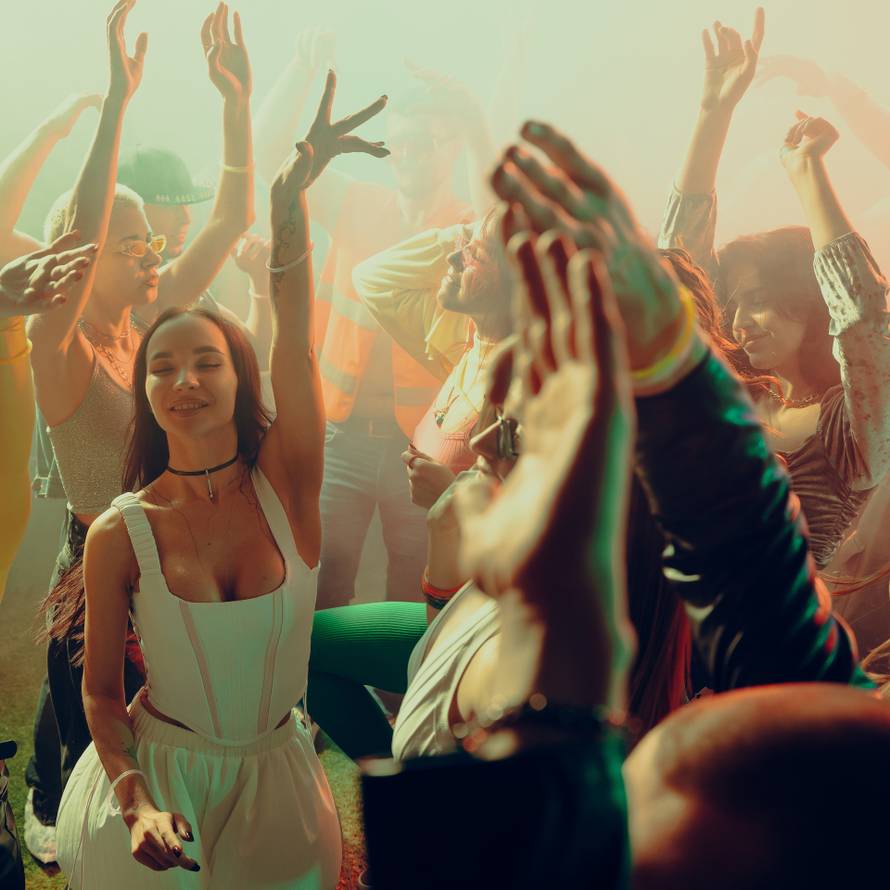 People,Dancing,Energetically,At,A,Lively,Party,With,Colorful,Lighting.