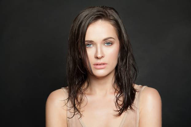 Woman face on black background